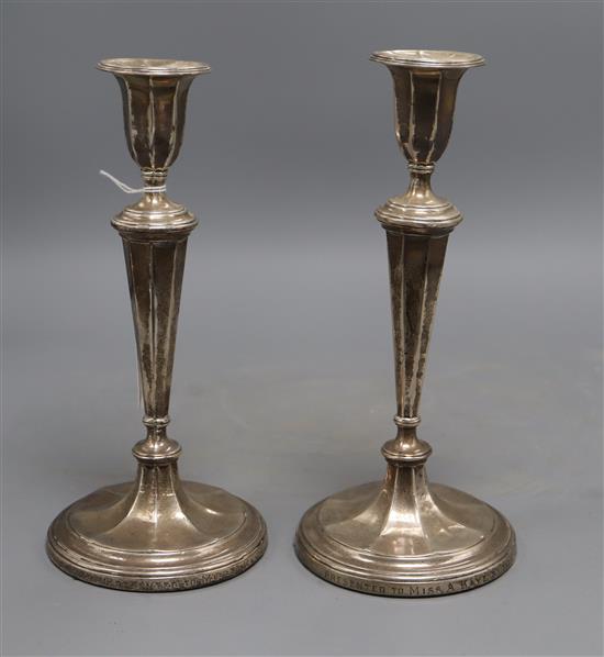 A pair of Edwardian silver candlesticks, James Deakin & Sons, Sheffield, 1907, 24.7cm, weighted.